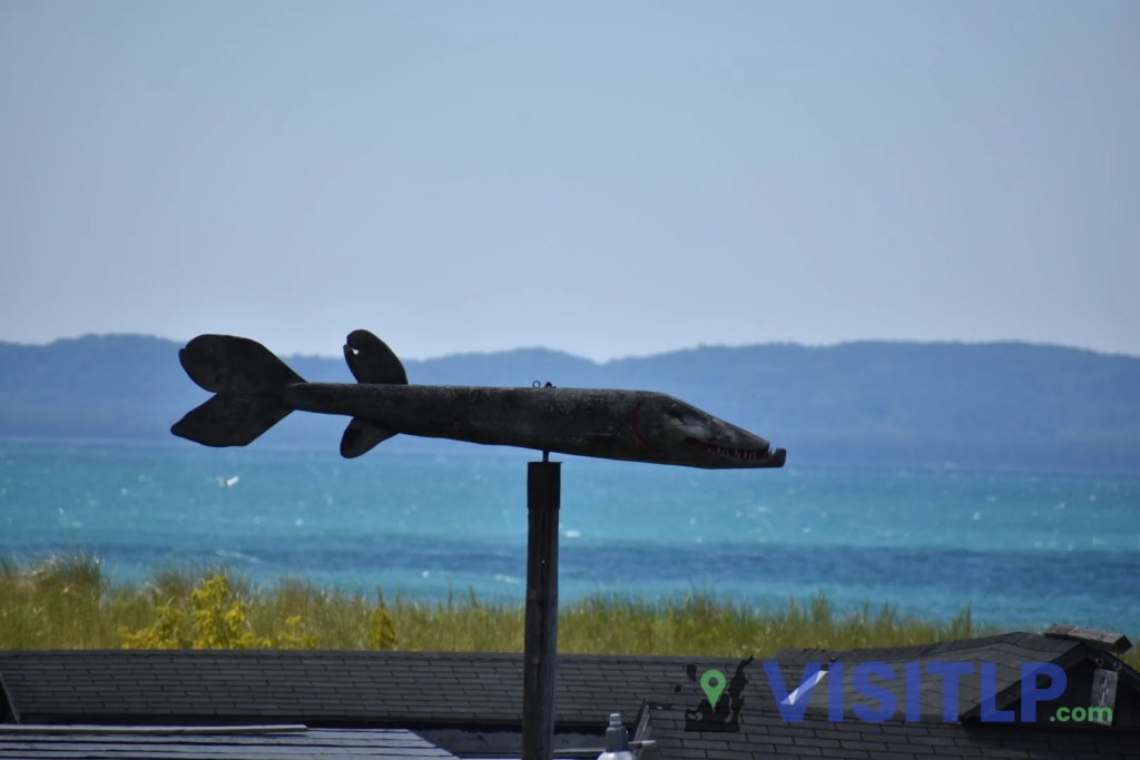 Fish-shaped sculpture overlooking the water in Fishtown