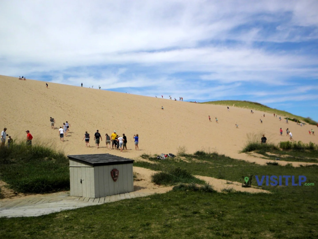 Visitors climbing the Sleeping Bear Dunes